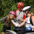 Cyclists check the route